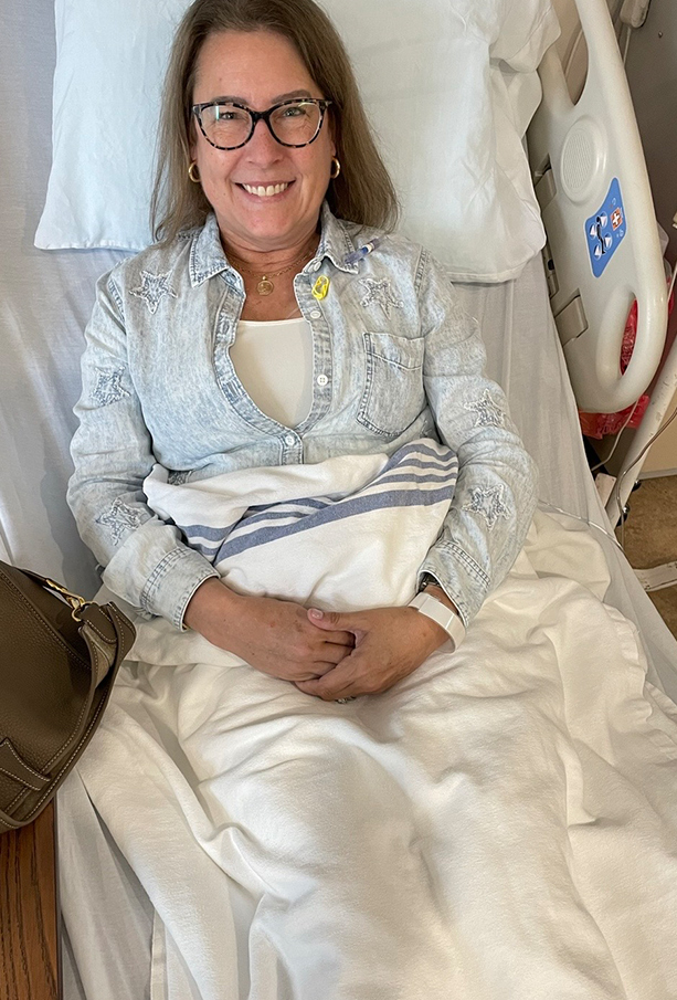 Jen Schafer in a hospital bed during cancer treatment